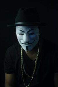 photo of person wearing guy fawkes mask
