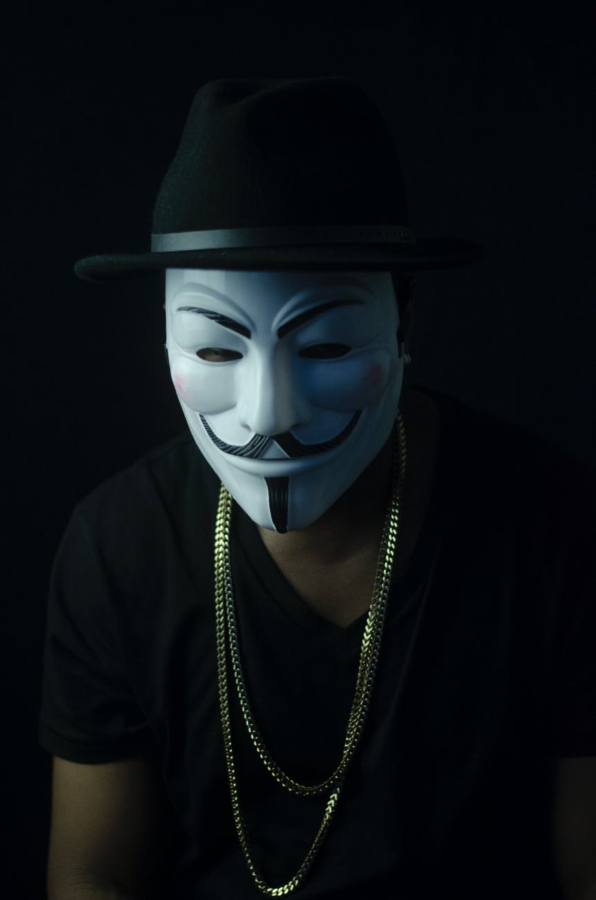 photo of person wearing guy fawkes mask